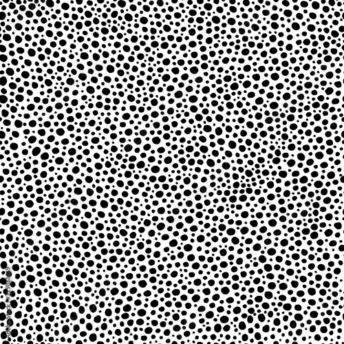 Seamless pattern. Black dots of irregular shape and different sizes isolated on white background. Art texture. Texture for print, wallpaper, home decor, textile, package design