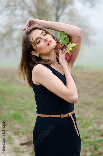 beautiful sexy girl, posing in the nature, autumn dresses photo