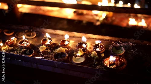 Candles close-up in the Indian Temple on a Religious Festival Diwali. Oil Lamp