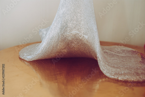 glitter slime transparent flexible viscous. game for children. antistress. beautiful background