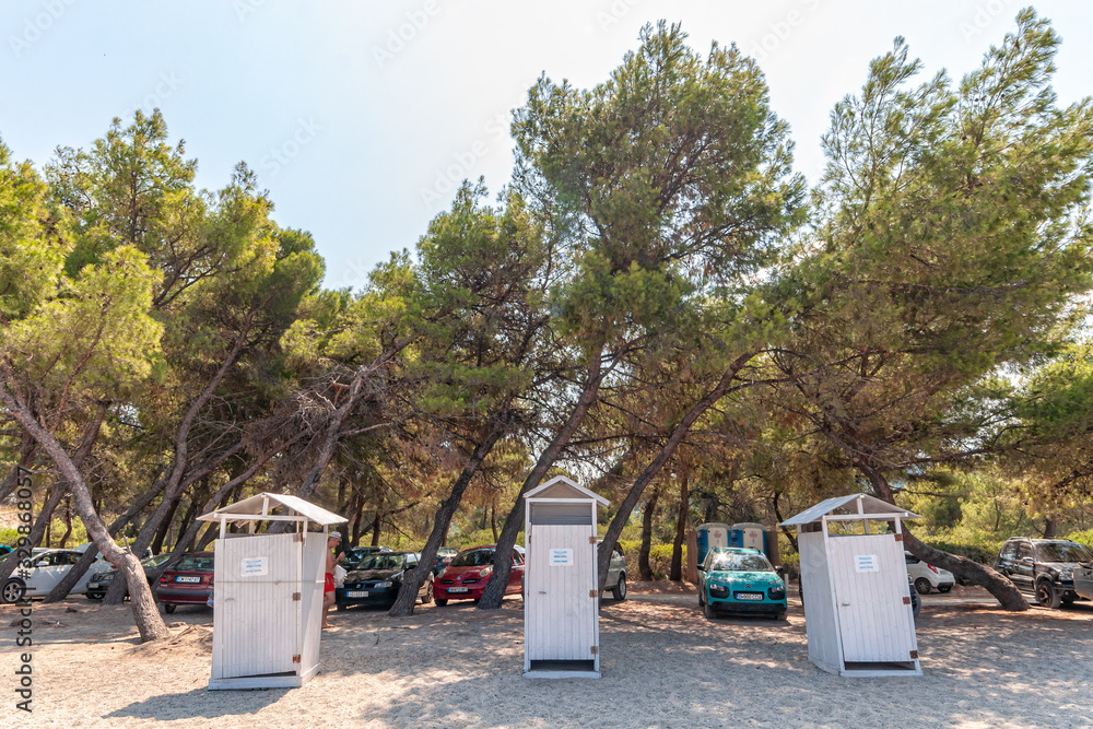 Halkidiki, Greece - September 05,2019: Porto Beach near Pefkochori, Halkidiki, Greece. Public dressing room on the beach Halkidiki, Greece - September 05,2019: Porto Beach near Pefkochori, Halkidiki, Greece. Public dressing room on the beach