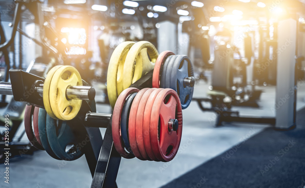rack with differen weights in modern gym