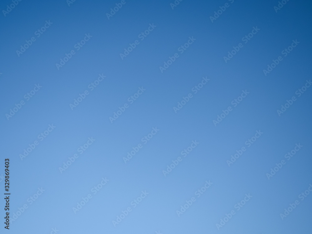 background, blue cloudless sky with gradient transitions