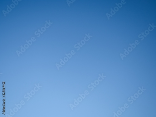 background, blue cloudless sky with gradient transitions photo