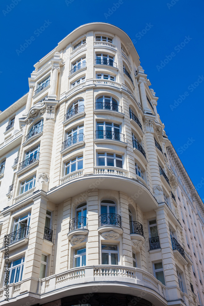 Beautiful architecture of the antique buildings located at Gran via street in Madrid
