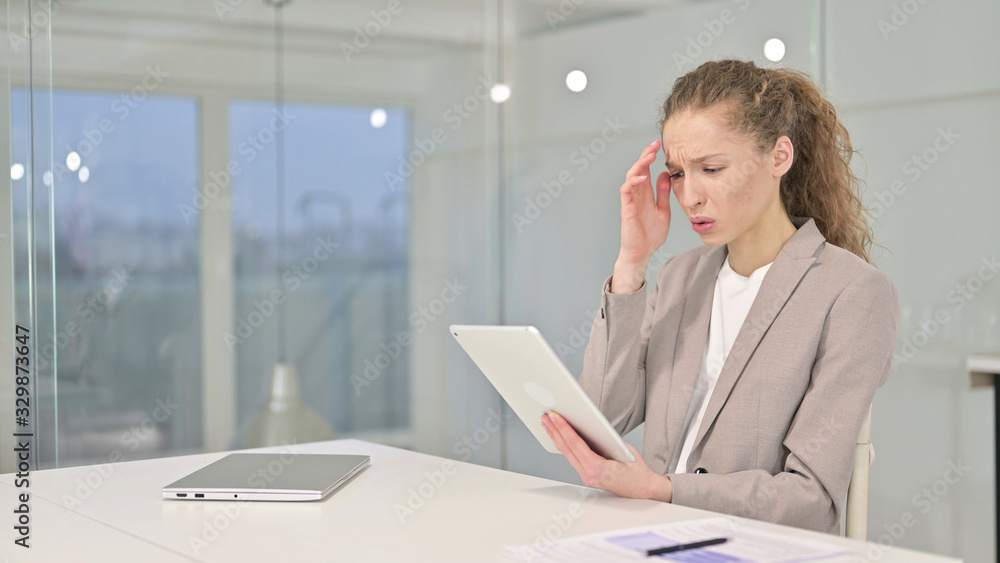 Disappointed Young Businesswoman Reacting to Loss on Tablet Disappointed Young Businesswoman Reacting to Loss on Tablet