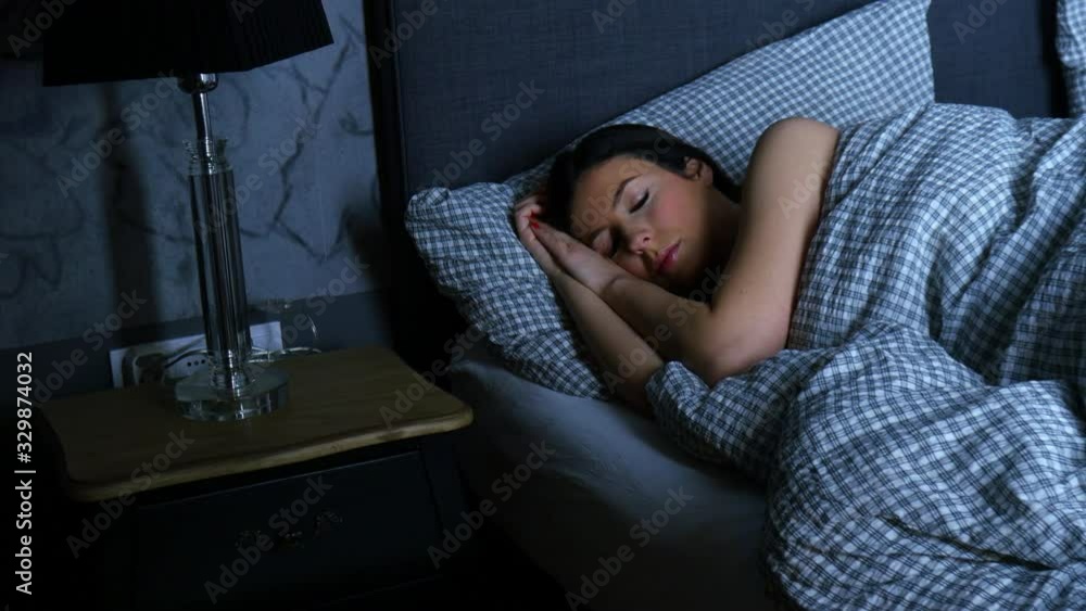 A beautiful woman sleeping alone in bed A beautiful woman sleeping alone in bed