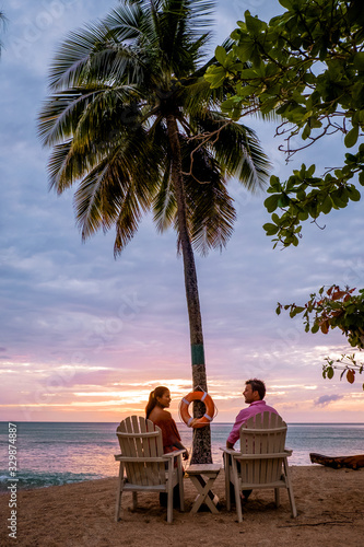 Saint Lucia Caribbean Island, couple on luxury vatation at the tropical Island of Saint Lucia, men and woman by the beach and crystal clear ocean of St Lucia Caribbean Holliday photo