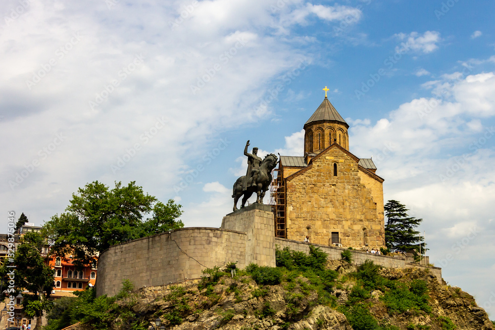 The Metekhi Virgin Mary Assumption Church and statue of King Vakhtang Gorgasali overlook the east bank of the Kura river in Tbilisi, Georgia