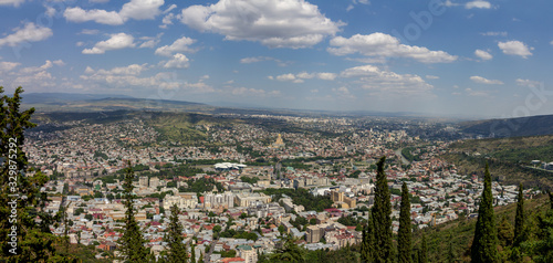 Cityscape of Tbilisi, Georgia as viewed from Mtatsminda View Point. The Holy Trinity Cathedral of Tbilisi is a prominent landmark.