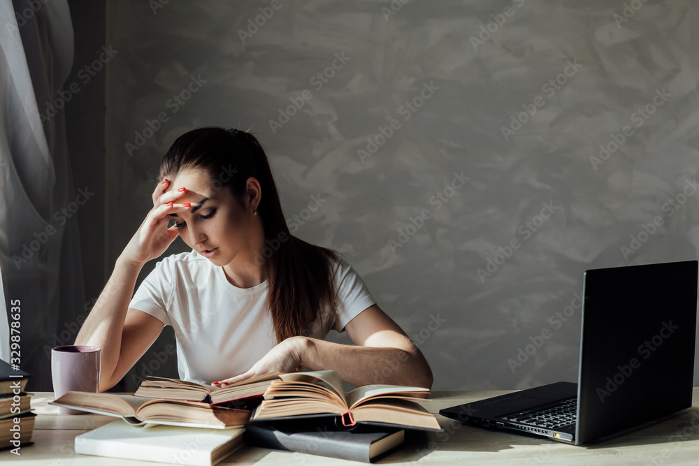 girl is preparing for the exam and reads a book girl is preparing for the exam and reads a book