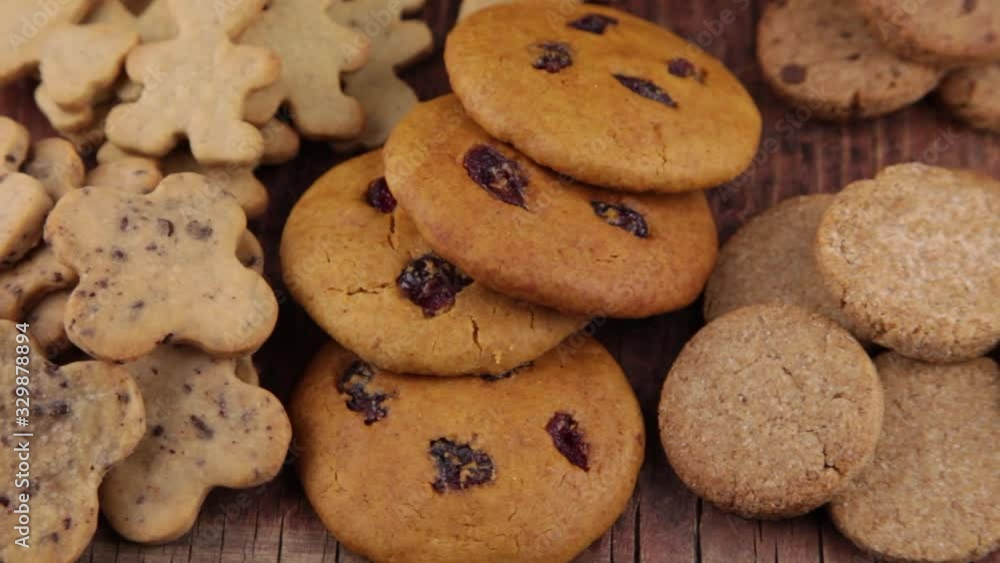 A set of different homemade cookies. Cookies close-up. Background from delicious pastries. Cookie with coconut, mishdal, chocolates, raisins, lingonberries. Round, rhombuses, bears, flowers shapes. A set of different homemade cookies. Cookies close-up. Background from delicious pastries. Cookie with coconut, mishdal, chocolates, raisins, lingonberries. Round, rhombuses, bears, flowers shapes.