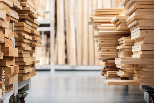 stacked wooden boards in a woodworking industry. stacks with pine lumber. folded edged board. wood harvesting shop. timber for construction photo