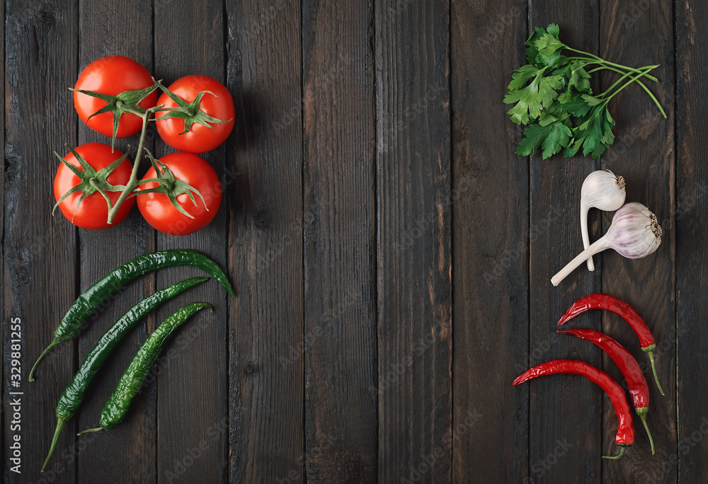 Fresh vegetables laid out on an old wooden background with copy space. Fresh vegetables laid out on an old wooden background with copy space.