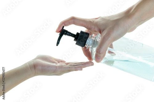 Close up mom hand applying cleaning gel on child hand on isolated white background
