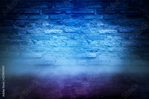 Texture dark concentrate floor with brick wall. spotlight color with mist or fog