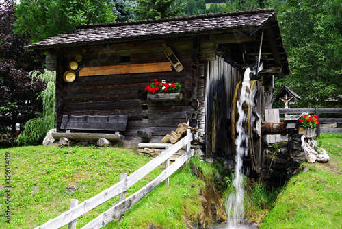 Wooden wheel of an ancient water mill in Austria, Europe