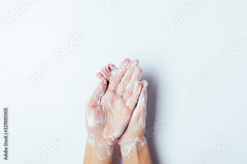 Process of washing hands with soap on white background