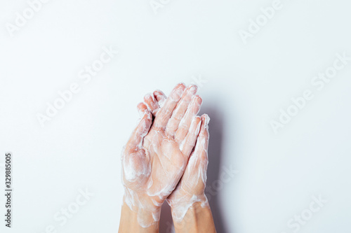 Bilde på lerret Process of washing hands with soap on white background