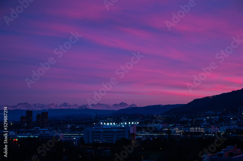 Beautiful sunset sky with pink and purple fiery clouds over Zurich city Switzerland