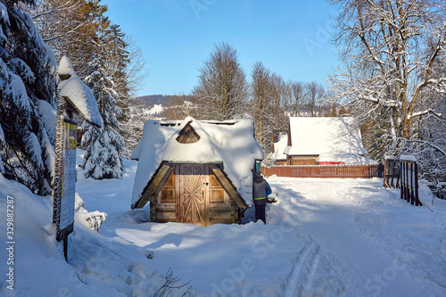 Tourists buying tickets by the entrance to Mala Laka Valley (Dolina Malej Laki) nearby Zakopane in Tatra mountains, Poland photo