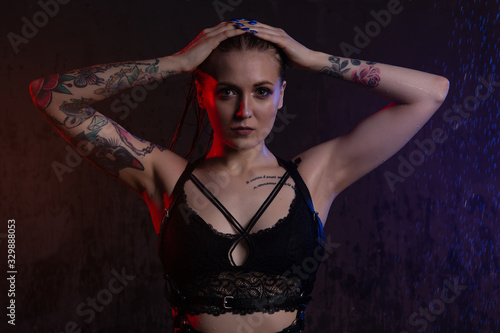 Obraz na plátně Beautiful blonde in black underwear takes a shower