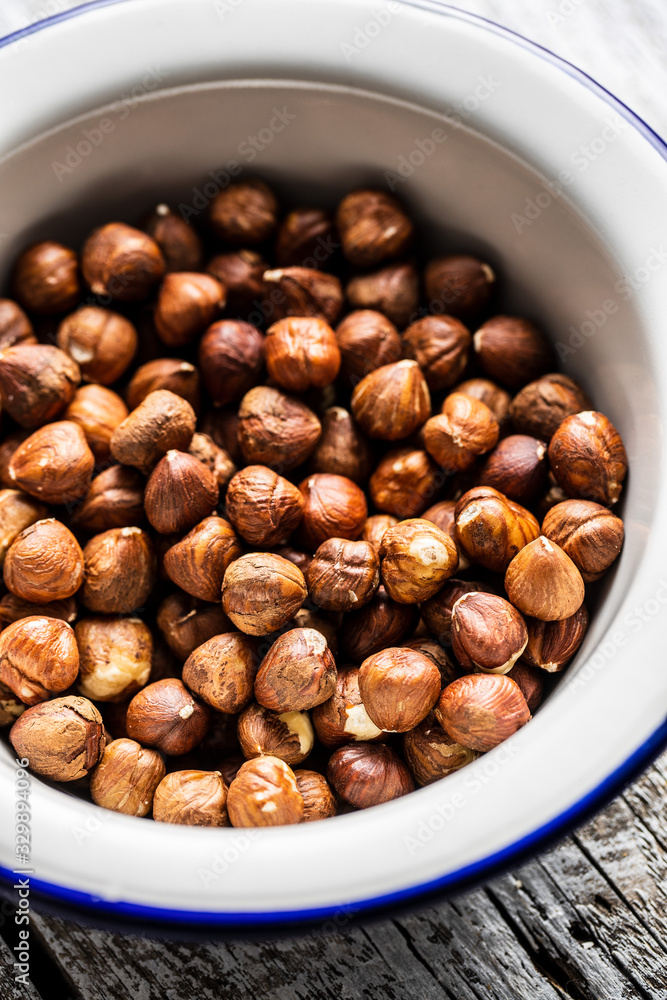 Fototapeta premium Peeled hazelnuts in bowl.