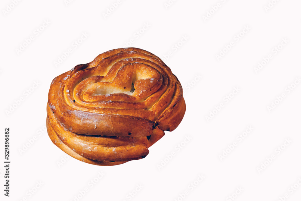 Fototapeta premium Freshly baked bun with a crispy crust close-up isolate on a white background.