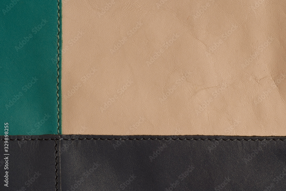 sewing machine seam and genuine leather in turquoise beige dark blue color , background sewing machine seam and genuine leather in turquoise beige dark blue color , background