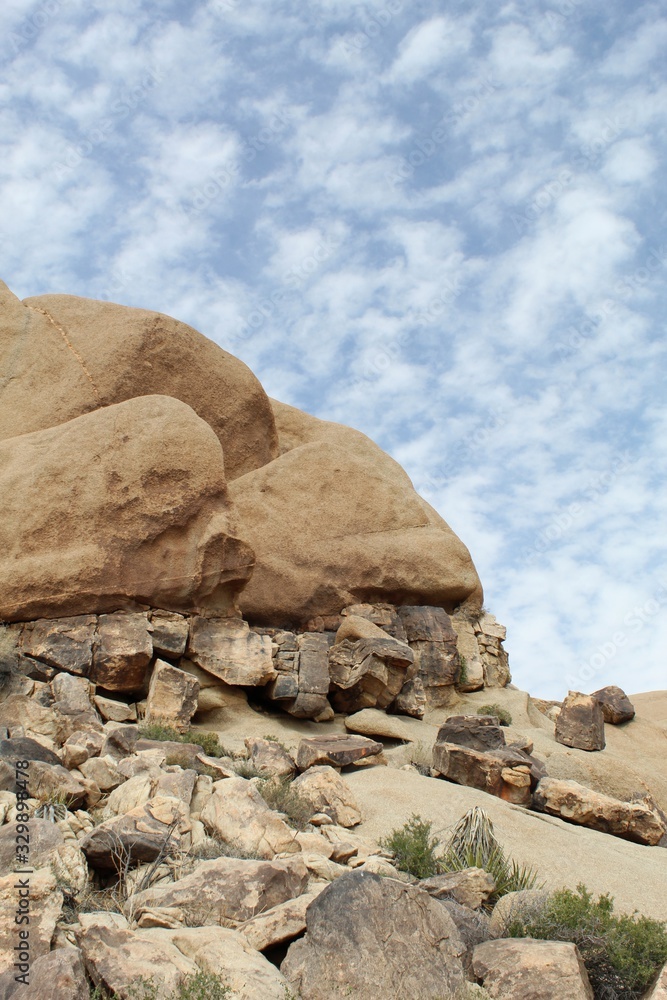 Appearing as small ribbons through rock formations in Joshua Tree National Park, Southern Mojave Desert, Geologic Veins form as part of the molten solidification process.