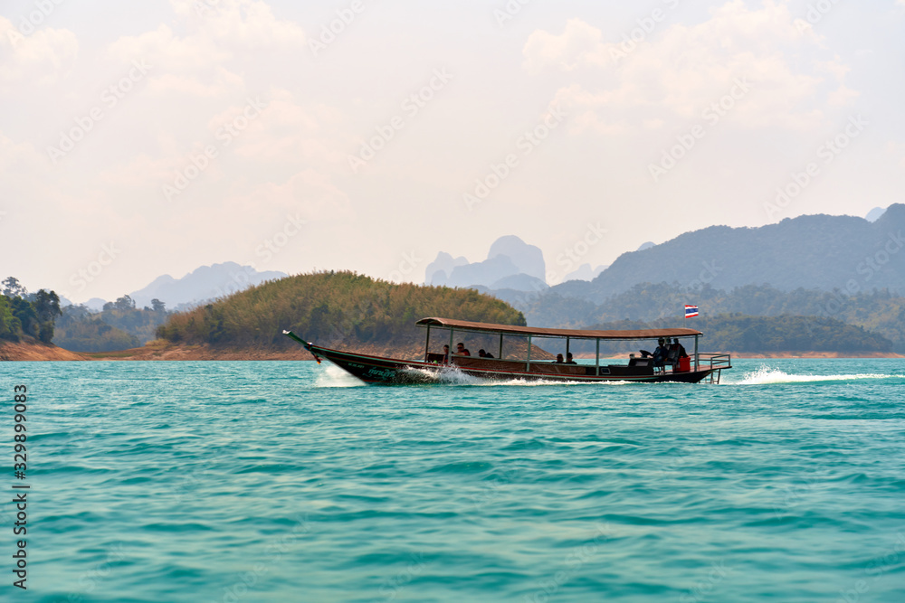 Thai passenger boat. Khao SOK national Park is nature reserve in South of Thailand with dense untouched jungles, limestone karst formations, an artificial lake Cheo LAN Surat Thani. February 26, 2020