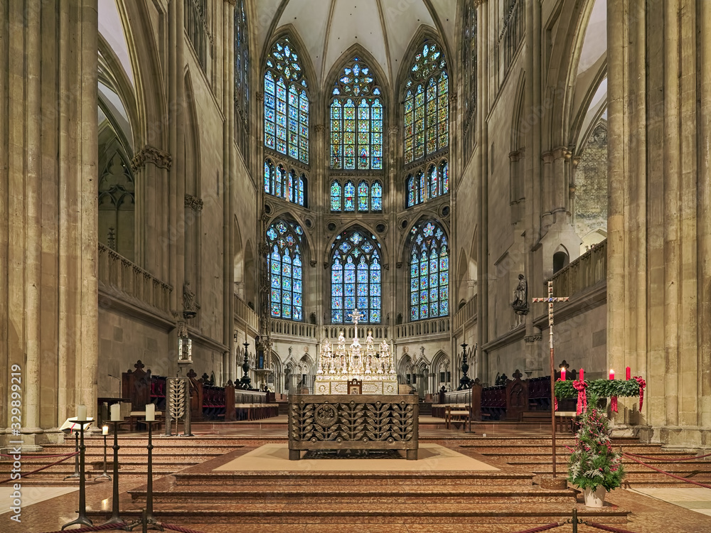 Regensburg, Germany. Interior of Regensburg Cathedral with Main altar, choir, silver High altar and apse with original medieval stained glass windows. The cathedral was built from 1275 to 1520.