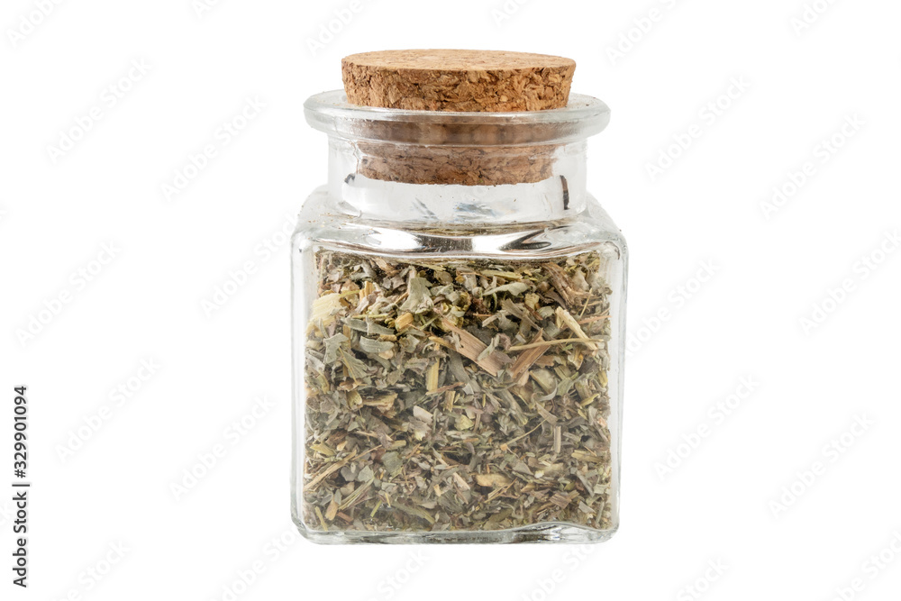 wormwood herb or in latin Absinthii herba herb in a glass jar isolated on white background. medicinal healing herbs. herbal medicine. alternative medicine wormwood herb or in latin Absinthii herba herb in a glass jar isolated on white background. medicinal healing herbs. herbal medicine. alternative medicine