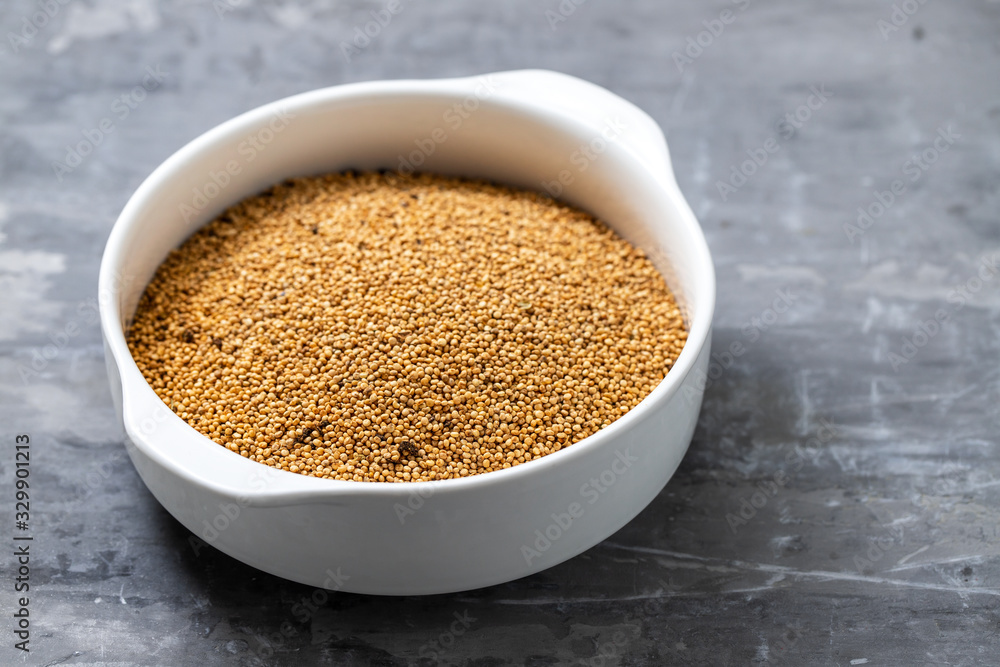quinoa on white bowl on ceramic background quinoa on white bowl on ceramic background