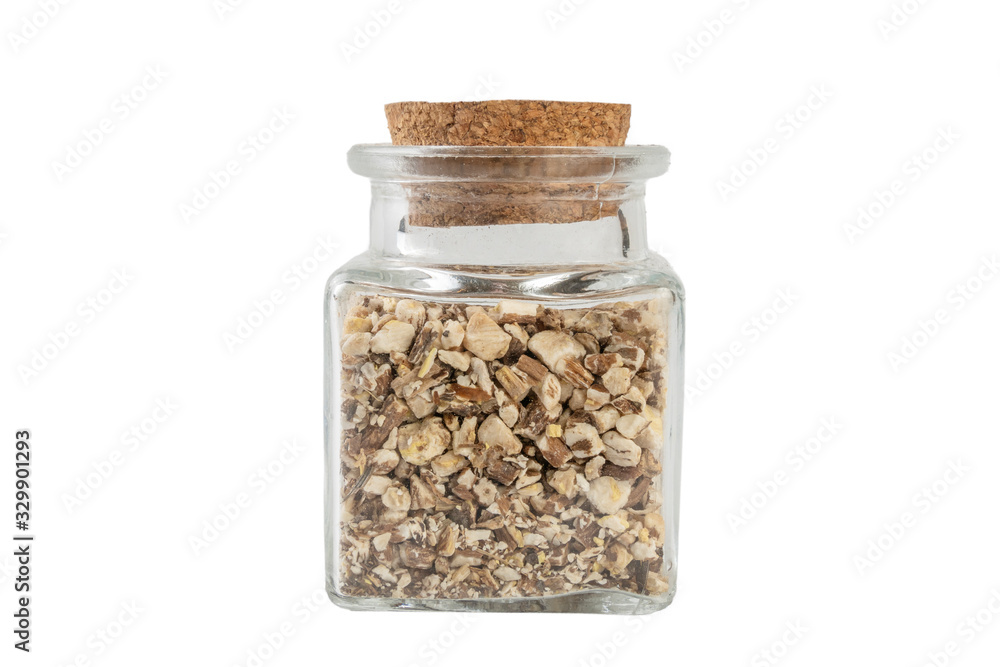 dandelion root or in latin Taraxaci radix in a glass jar isolated on white background. medicinal healing herbs. herbal medicine. alternative medicine dandelion root or in latin Taraxaci radix in a glass jar isolated on white background. medicinal healing herbs. herbal medicine. alternative medicine