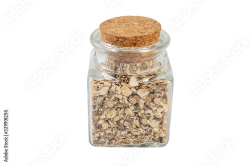 dandelion root or in latin Taraxaci radix in a glass jar isolated on white background. medicinal healing herbs. herbal medicine. alternative medicine