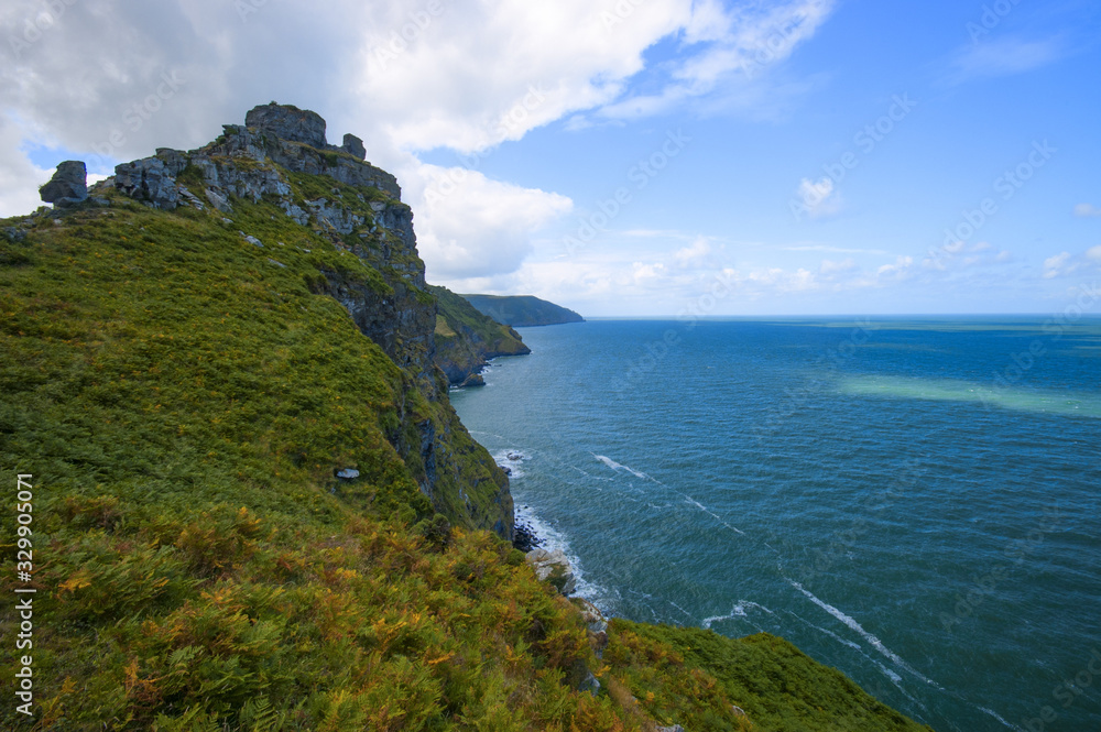 Valley of the Rocks, North Devon, with blue sky, clouds and ocean with waves