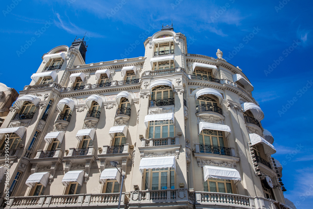 Beautiful architecture of the antique buildings located at Madrid city center