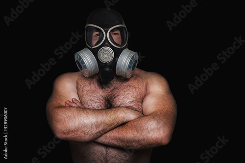 man with gas mask on black