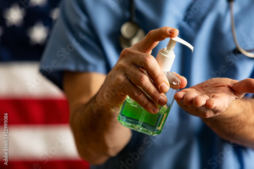 Health: Male Doctor With Pump Bottle Of Hand Sanitizer To Kill Virus