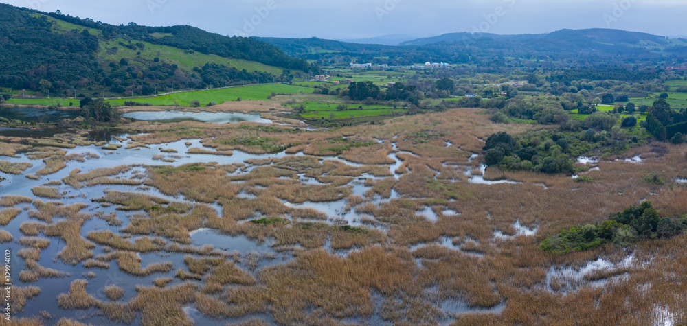 Aerial view of the Victoria marshes, Noja. Marismas de Santoña, Victoria y Joyel Natural Park, Cantabrian Sea, Cantabria, Spain, Europe Aerial view of the Victoria marshes, Noja. Marismas de Santoña, Victoria y Joyel Natural Park, Cantabrian Sea, Cantabria, Spain, Europe