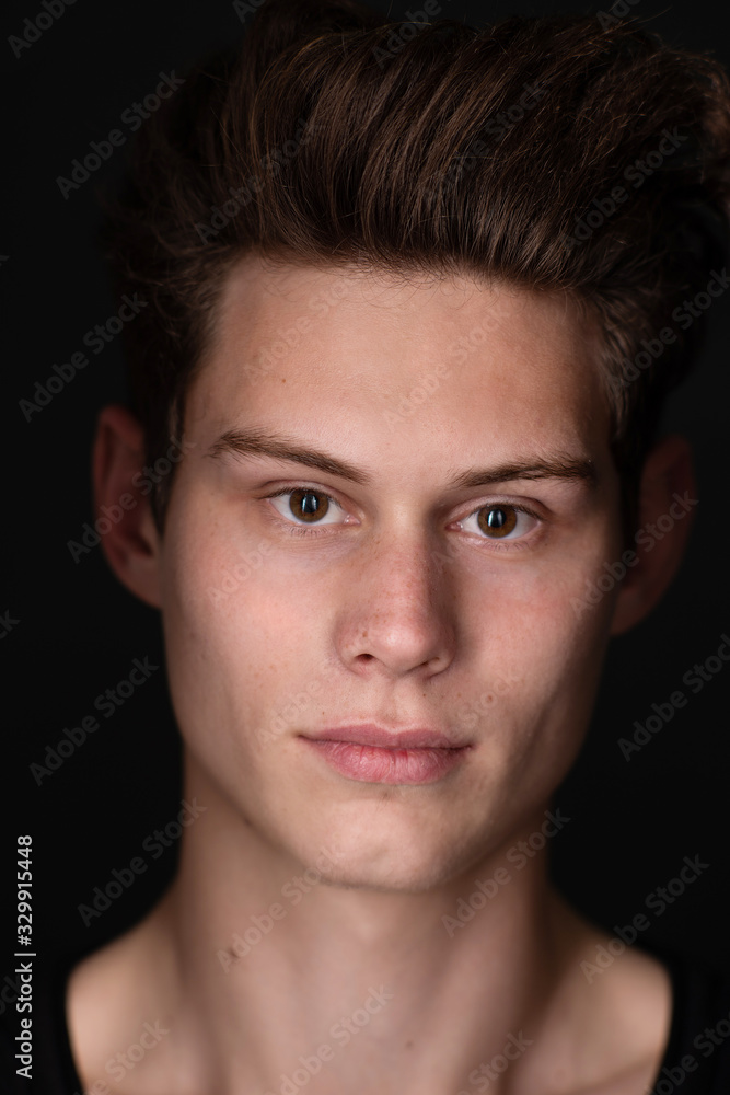 Portrait of a young handsome dark haired man with a fan Portrait of a young handsome dark haired man with a fan