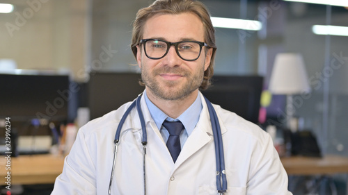 Portrait of Cheerful Doctor Smiling at Camera