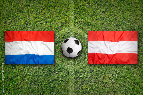 Netherlands vs. Austria flags on soccer field