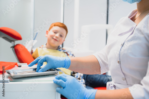 Boy satisfied with the service in the dental office. concept of pediatric dental treatment