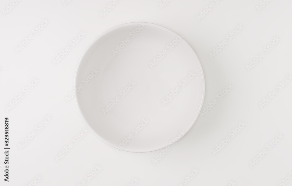 Empty ceramic round plate isolated on white background Empty ceramic round plate isolated on white background