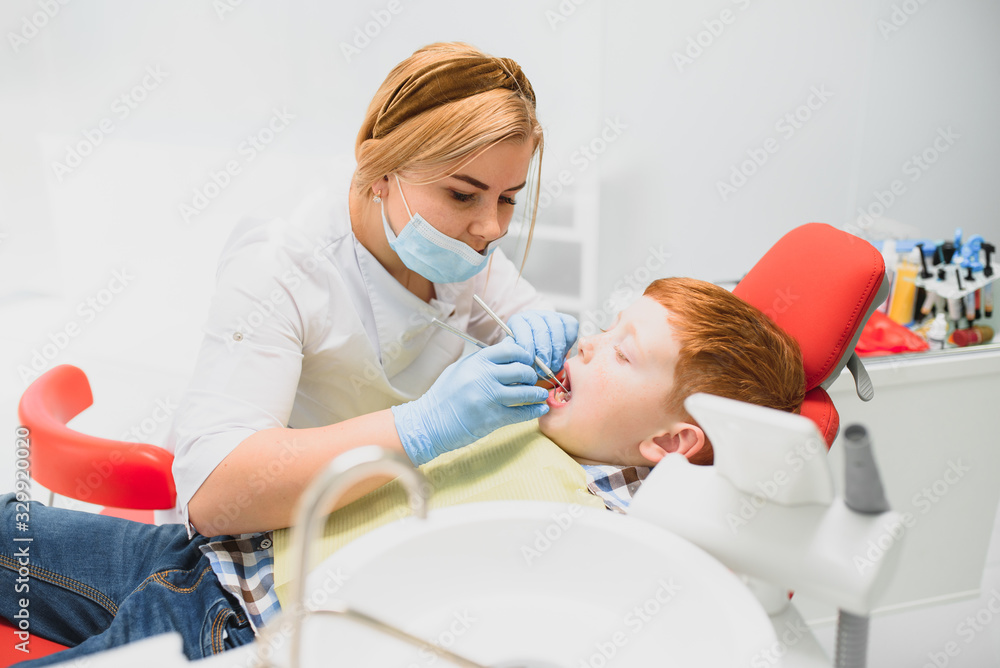 Boy satisfied with the service in the dental office. concept of pediatric dental treatment Boy satisfied with the service in the dental office. concept of pediatric dental treatment