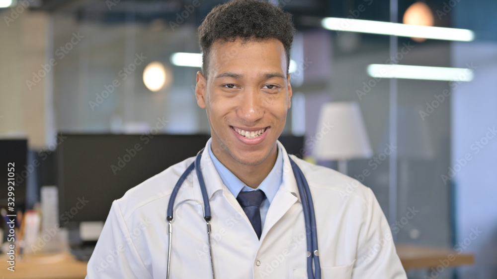 Portrait of Smiling Young Doctor Looking at Camera Portrait of Smiling Young Doctor Looking at Camera