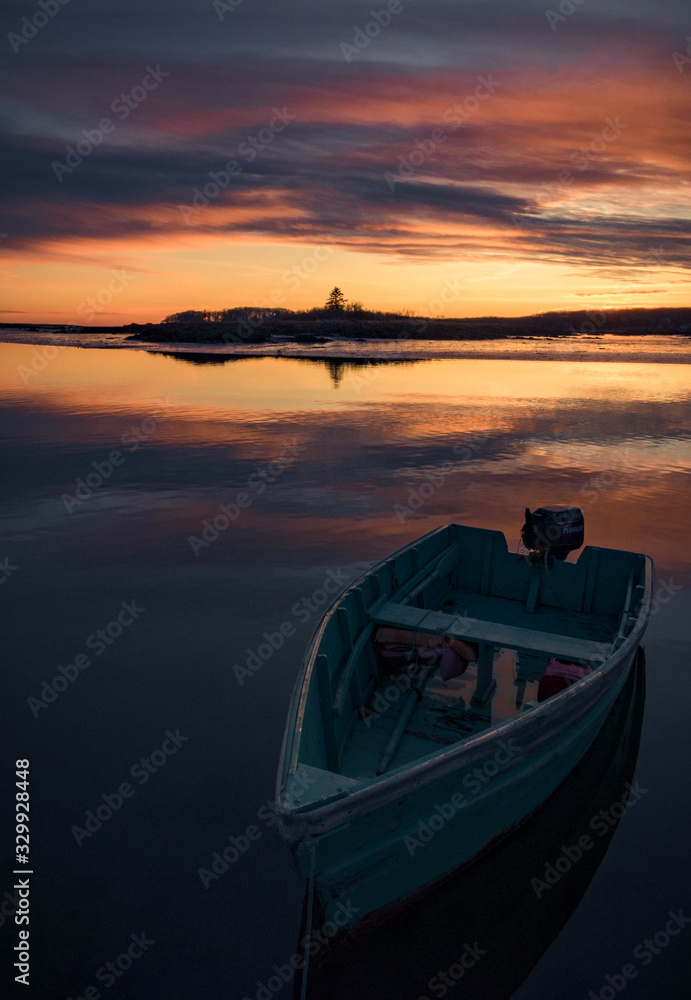 Lone boat in Cape Porpoise Harbor during sunset - Kennebunkport, Maine.