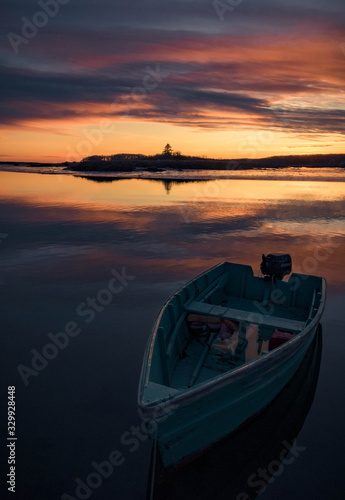 Lone boat in Cape Porpoise Harbor during sunset - Kennebunkport, Maine. © greg